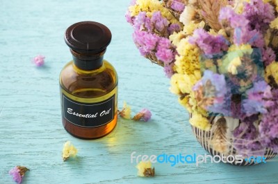 Bottle Of Essential Oil With Flower Stock Photo