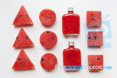 Bottle Of Fresh Watermelon Juice With  Watermelon Pieces  On Whi… Stock Photo