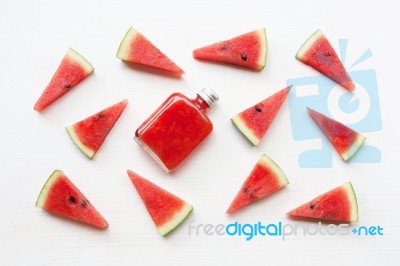 Bottle Of Fresh Watermelon Juice With  Watermelon Pieces  On Whi… Stock Photo