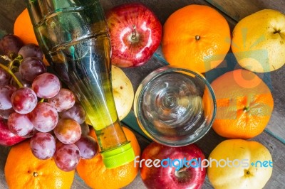 Bottle Of Juice On  Fruits Stock Photo