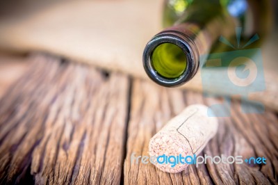 Bottle Of Wine With Corks On Old Wooden Stock Photo