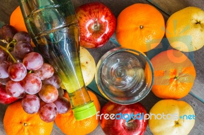 Bottle On Many Of Fruits Stock Photo