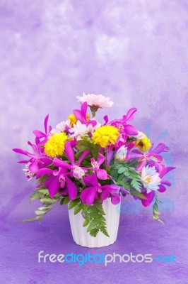 Bouquet Of Chrysanthemum And Orchid Flowers Isolated On Purple V… Stock Photo