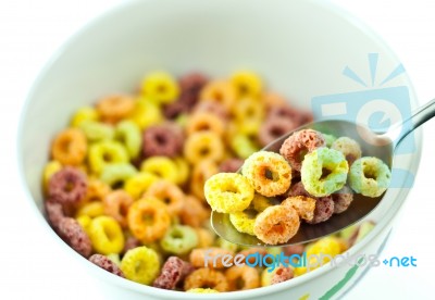 Bowl And Spoon With Cereal Stock Photo