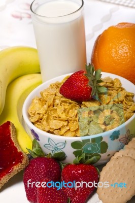 Bowl Of Cereals With Fruit And Milk Stock Photo