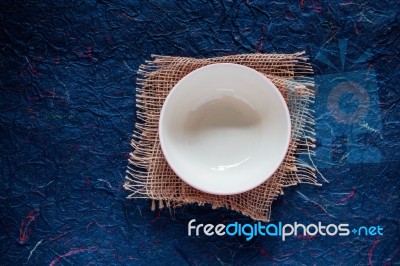 Bowl On Blue Background Stock Photo