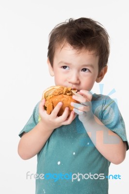 Boy Eating A Burger Stock Photo