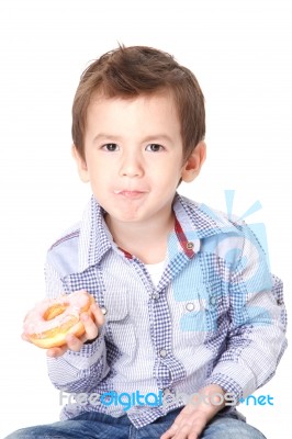 Boy Eating A Donut Stock Photo