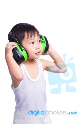 Boy In A White Singlet Wearing Earmuffs Stock Photo