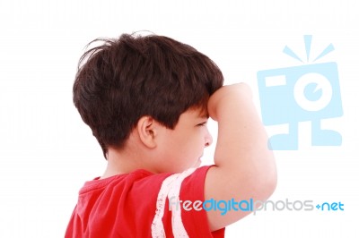 Boy Intently Looking Far Away Stock Photo