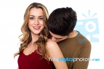 Boy Kissing His Pretty Girlfriend Stock Photo