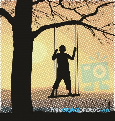 Boy On A Tree Swing Stock Image