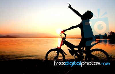 Boy On BMX Silhouette Background   Stock Photo