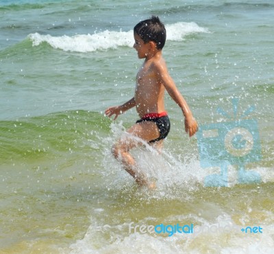 Boy On The Beach Stock Photo