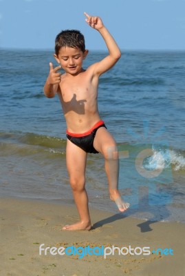 Boy On The Beach Stock Photo