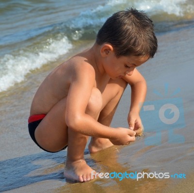 Boy On The Beach Stock Photo