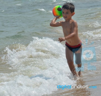 Boy On The Beach Stock Photo