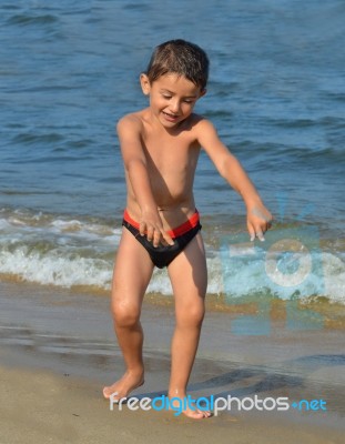 Boy On The Beach Stock Photo