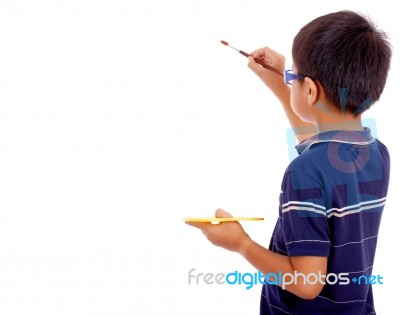 Boy Painting On Blank Board Stock Photo