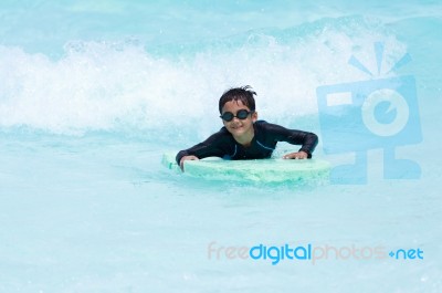 Boy Play In Clear Water Stock Photo