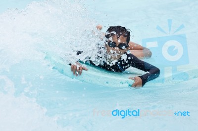 Boy Play In Clear Water Stock Photo