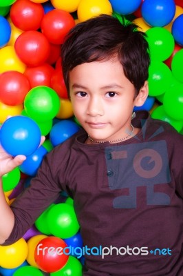 Boy Playing In Ball Land Stock Photo