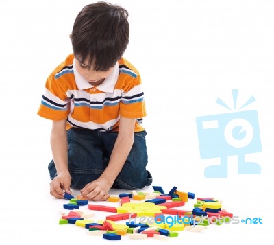 Boy Playing With Blocks Stock Photo