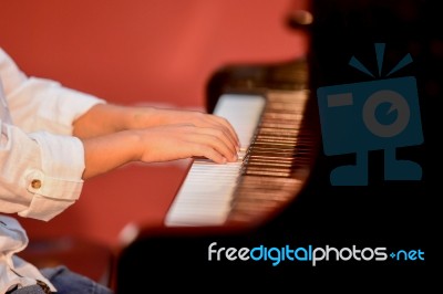 Boy Plays Piano Stock Photo