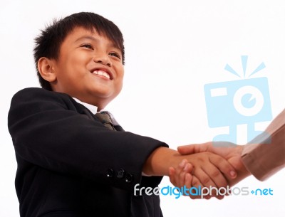 Boy Shaking Hands Stock Photo