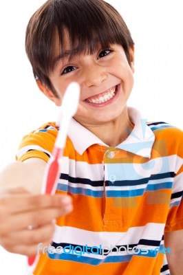 Boy Showing The Toothbrush Stock Photo