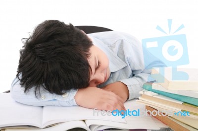 Boy Tired And Sleeping On Books Stock Photo