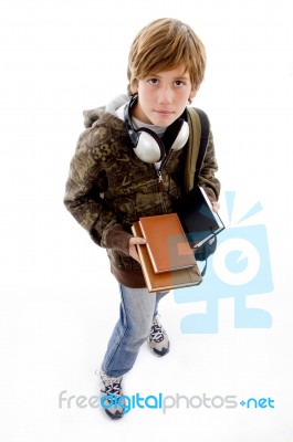 Boy With Books And Headphone Stock Photo