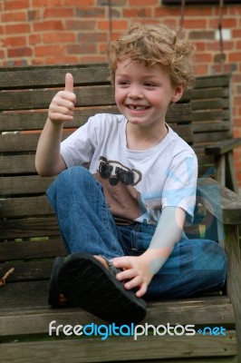 Boy With Thumbs Up, Missing Some Teeth Stock Photo