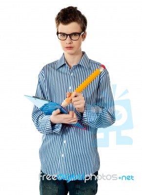 Boy Writing On Clipboard Stock Photo