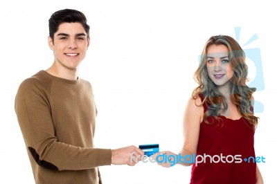 Boyfriend Handing Over The Credit Card To His Girl Stock Photo