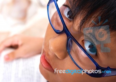 Brainy School Kid Reading A Book Stock Photo