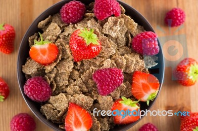 Bran Flakes With Fresh Raspberries And Strawberries Stock Photo