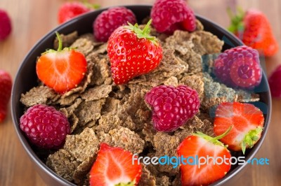 Bran Flakes With Fresh Raspberries And Strawberries Stock Photo