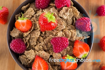 Bran Flakes With Fresh Raspberries And Strawberries Stock Photo