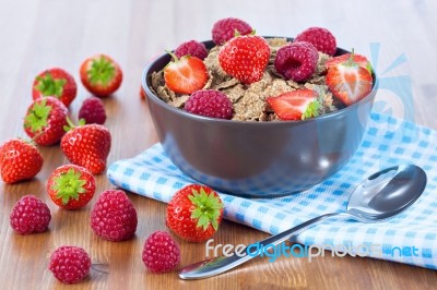 Bran Flakes With Fresh Raspberries And Strawberries Stock Photo