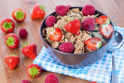 Bran Flakes With Fresh Raspberries And Strawberries Stock Photo