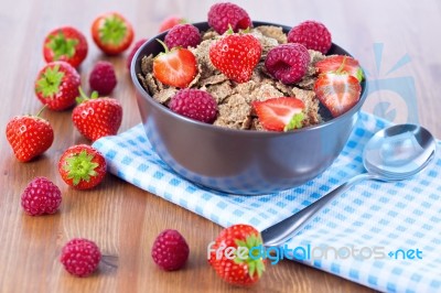 Bran Flakes With Fresh Raspberries And Strawberries Stock Photo