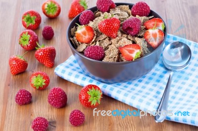 Bran Flakes With Fresh Raspberries And Strawberries Stock Photo