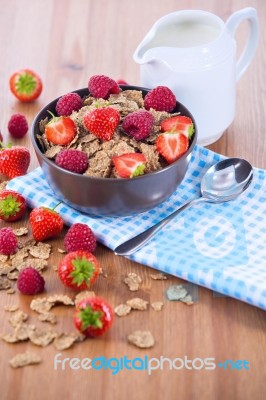 Bran Flakes With Fresh Raspberries And Strawberries And Pitcher Stock Photo