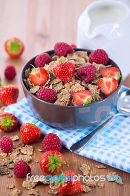 Bran Flakes With Fresh Raspberries And Strawberries And Pitcher Stock Photo