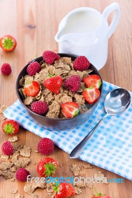 Bran Flakes With Fresh Raspberries And Strawberries And Pitcher Stock Photo