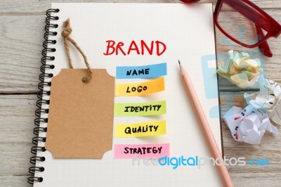 Brand Marketing Concept With Brand Tag On Notebook Stock Photo