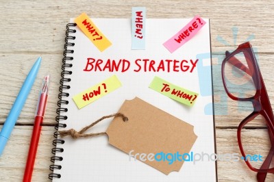 Brand Marketing Strategy Concept With Brand Tag On Notebook Stock Photo