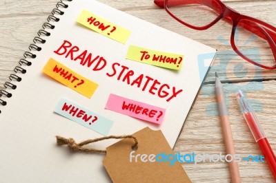 Brand Marketing Strategy Concept With Office Desk Stock Photo