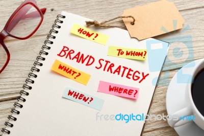 Brand Strategy Marketing  Concept With Notebook On Work Table Stock Photo